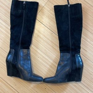 Knee high suede with patent leather detailing, wedge heel boots.